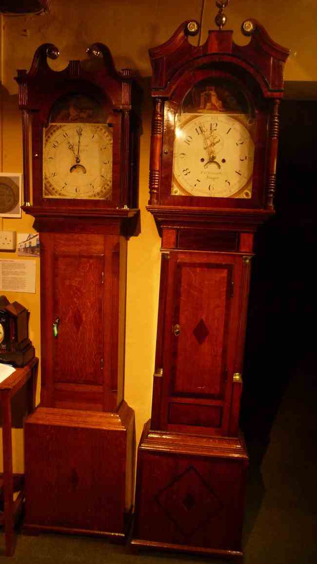 The recently donated Skarratt clock (right) standing next to another Skarratt clock in the Kington Museum.