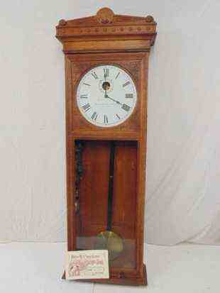 Self Winding clock Company oak wall clock, with