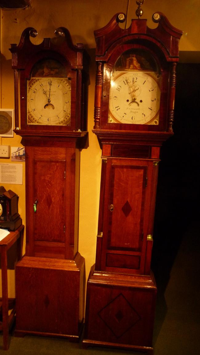 The recently donated Skarratt clock (right) standing next to another Skarratt clock in the Kington Museum.